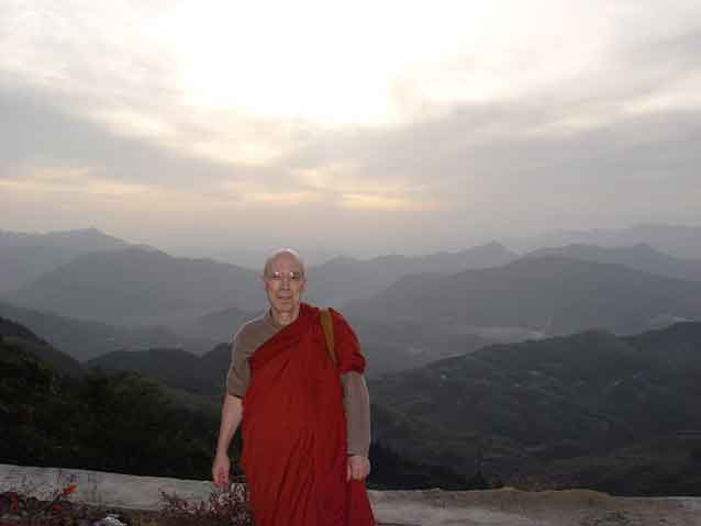 Venerable Bhikkhu Bodhi against a backdrop of the China Mountains